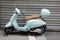 Vespa blue green motorbike Italian brand of scooter manufactured by Piaggio