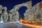 Vespasian gate to the ancient city of Side at night