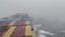 Vessel in storm. Cargo container vessel fully loaded sailing through north Pacific ocean