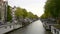 Vessels and houseboats along canals, Amsterdam, Netherlands