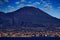 Vesuvio. Naples, twilight evening pink violet sunset. Town Napoli in Italy, travelling in the Europe. Urban landscape with city,