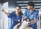 Vet doctors with dog are scrutinizing dog`s X-ray in veterinary clinic