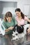 Vet Examining Border Collie\'s Ear With Otoscope By Woman