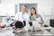 Vet And Female Nurse Examining Border Collie At Table