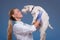 Vet holding a cute dog above head