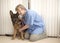 Vet monitoring an Alsatian dogs heartbeat