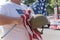 Veteran with US flag and WWI helmet on parade