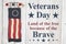 Veterans Day message with old wood flag on a weathered whitewash wood