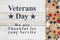 Veterans Day message with stars on a weathered whitewash wood