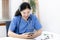 Veterinarian or animal nurse is using a phone or tablet to collect veterinary history
