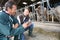 Veterinarian and breeder in barn