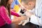 Veterinarian checking cat\'s ear at vet ambulant