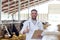 Veterinarian with cows showing thumbs up on farm