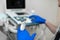 A veterinarian does an ultrasound of the dog`s eye in the office. Male doctor`s hand on the ultrasound machine. Ultrasound senso