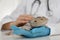 Veterinarian examining bearded lizard on table in clinic. Exotic pet