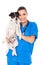 Veterinarian holding dog