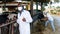 Veterinarian inspecting cows in dairy farm