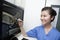 Veterinarian looking and pointing at animal\'s x-ray