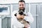 Veterinarian pet doctor holding cat patient in his animal clinic