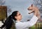 Veterinarian raising piglet in the air