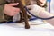 veterinarian shaves a small dog to connect electrodes for an electrocardiogram examination