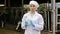 Veterinarian standing close to cows