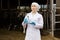 Veterinarian standing with test bottle