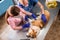 Veterinarian team bandages the paw of a sick Corgi dog