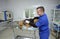 Veterinarian vetting stray dog lying on the med table.October 4, 2019. Municipal animal shelter.  Borodyanka, Ukraine