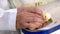 Veterinarian who vaccinates young chickens on a farm. The doctor`s hand holds a mole that is automatically vaccinated