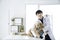 Veterinary concept. The vet is looking camera with the Golden Retriever dog. Sick Golden Retriever dog in the veterinary clinic