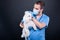 Veterinary examining white bichon dog ear