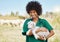 Veterinary, farm and woman holding sheep on livestock field for medical animal checkup. Happy, smile and female vet