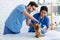 Veterinary medicine. Young animal doctors conducting examination of small dog at hospital