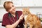 Veterinary Nurse Examining Cat In Surgery