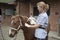 Veterinary nurse treating a pony