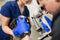 Veterinary, ophthalmologists examine the injured eye of a dog with a slit lamp in a veterinary clinic