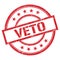 VETO text written on red vintage stamp