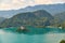 Vew of Bled lake with mountains, island and pilgrimage church, view from the Bled Castle upper yard, Slovenia.