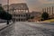 Via dei Fori Imperiali street in the historic center of Rome, Italy, completely deserted, with the Colosseum in the background