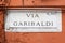 Via Garibaldi, street plate on a wall in Rome