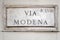 Via Modena street sign on wall in Rome