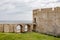 The viaduct bridge to the Castello Maniace citadel in Siracusa, Sicily, Italy in a sunny day with clouds