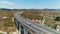 Viaduct traffic truck. Drone shot sunny day blue sky