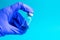 Vial with cure Covid-19. Doctor, nurse or scientist hand in blue gloves holds a vaccine coronavirus