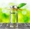 Vial of liquid on nature background