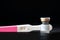 Vial of medication and pregnancy test.