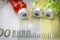 Vials with different substances over euros