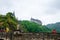 Vianden, Luxembourg - July 27, 2019: Vianden Castle on a hill with a bridge, a restaurant and Our river in Vianden, Luxembourg