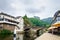 Vianden, Luxembourg - July 27, 2019: Vianden Castle on a hill with a bridge, a restaurant and Our river in Vianden, Luxembourg